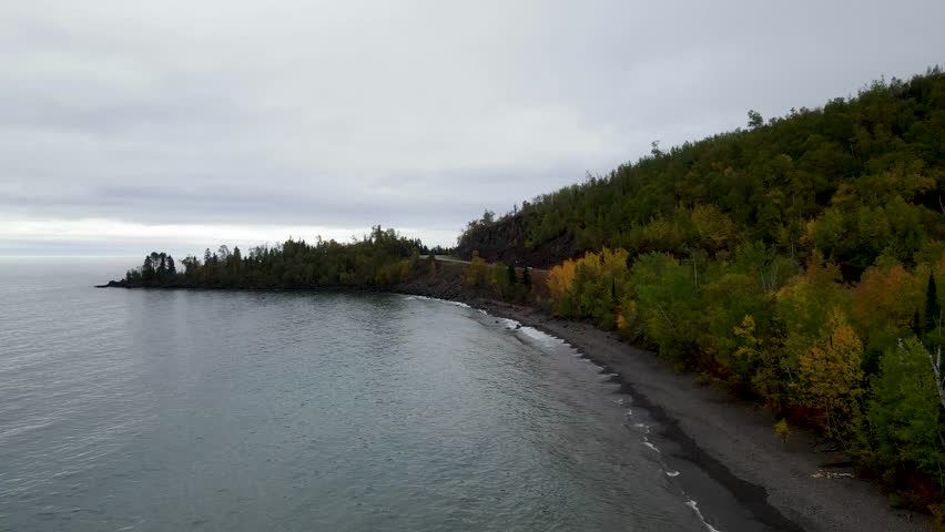 Drone shot of fall foliage and Lake Superior in Minnesota, USA