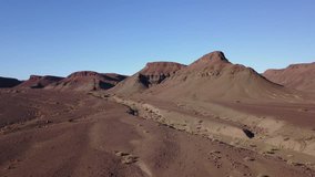 4K high quality aerial video scenic drone view of barren desolate waterless mountain landscape near Orange River and area of border town Noordoewer on sunny afternoon in Namibia, southern Africa