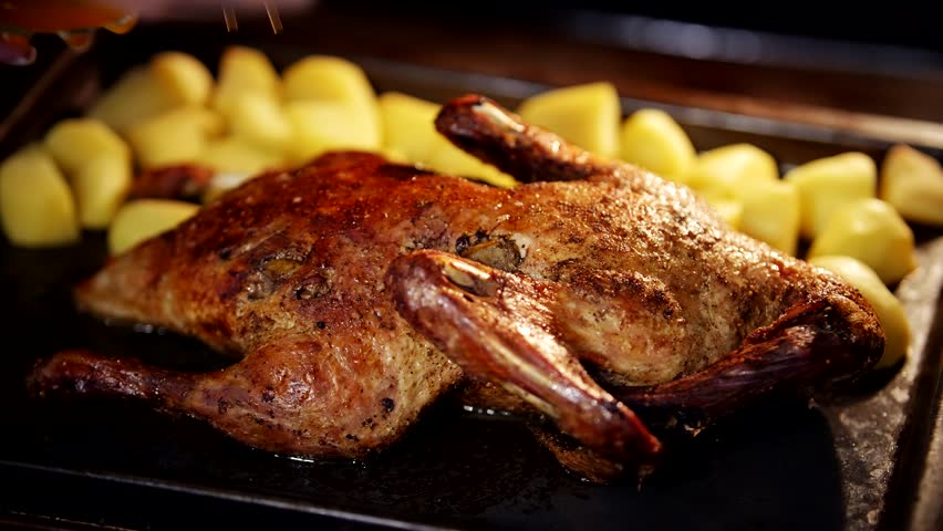 Holiday Dinner Cooking Roasted Goose Family Celebration. Baked Duck With Honey Home Cooking. Homemade Grilled Goose Meat. Cooking Whole Duck In Oven. Crispy Crust Roasted Duck For Holiday Celebration