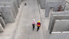 Top view of architectural engineering discussion at construction site and his blueprints planning project on precast concrete, Cement slab floor concrete slab stacked construction site.meeting, - Powered by Shutterstock - Get 15% off with code: PIKWIZARD15