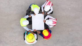 Top view of architectural engineering discussion at construction site and his blueprints planning project on precast concrete, Cement slab floor concrete slab stacked construction site.meeting, - Powered by Shutterstock - Get 15% off with code: PIKWIZARD15