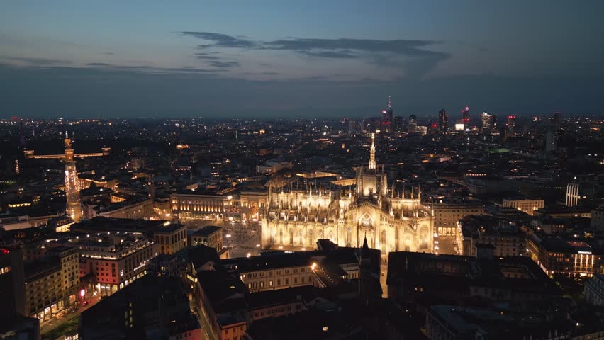 Establishing Aerial View Of Milan Cathedral Illuminated Piazza Del Duomo Di Milano And Galleria Vittorio Emanuele City Center Of Milano At Night, 4K Footage in Milan Italy Royalty-Free Stock Footage #3407880689
