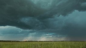4K Sky During Rain Horizon Above Rural Wheat Landscape Field. Agricultural And Weather Forecast Concept. Storm, Thunder, thunderstorm, stormclouds, Time Lapse, Timelapse, Time-lapse. Countryside - Powered by Shutterstock - Get 15% off with code: PIKWIZARD15