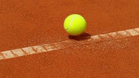 Super Slow Motion of Hitting Tennis Ball Out of Line. Low Depth of Focus. Filmed on High Speed Cinema Camera, 1000fps. - Powered by Shutterstock - Get 15% off with code: PIKWIZARD15