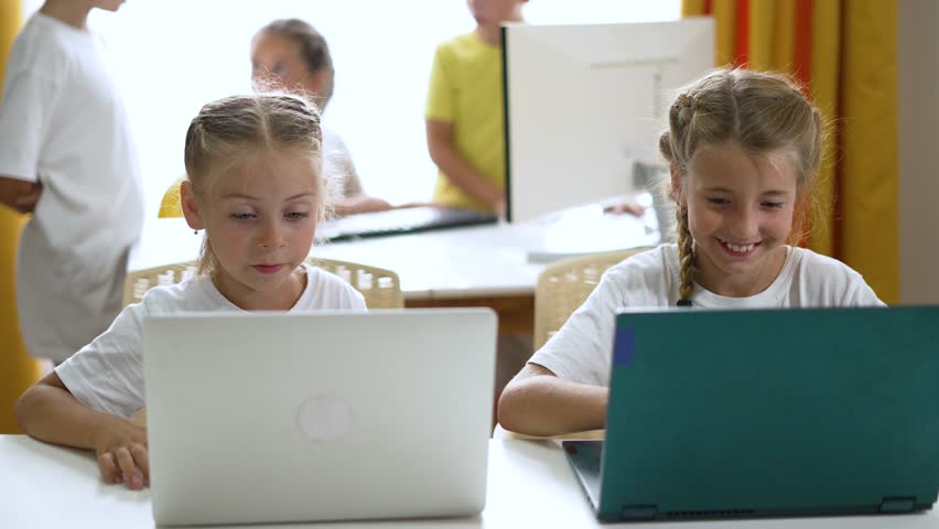 Group of children at school online learning. Teamwork of children with laptop online learning as a team. Children learn together at school to work as team with laptop.Team learning at school in lesson Royalty-Free Stock Footage #3407949035
