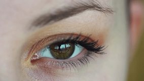 Close-up video of beautiful woman Hazel Eye with Extreme Long Eyelashes. 4k Resolution