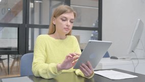 Young Blonde Woman Doing Video Chat on Tablet