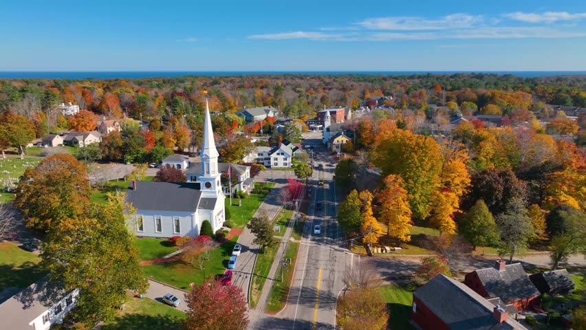 York village historic center aerial view in fall including First Parish Congregational Church, Old Methodist Church, and Town Hall on York Street in town of York, Maine ME, USA. 