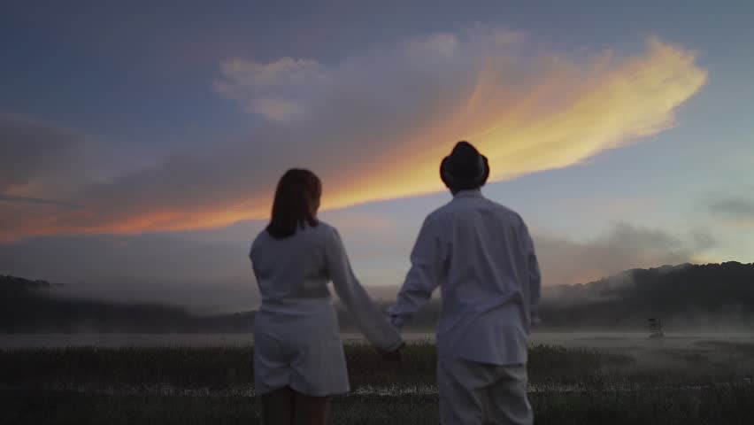 Couple See The Sky and Clouds When The Sunrise at Danau Tamblingan Bali