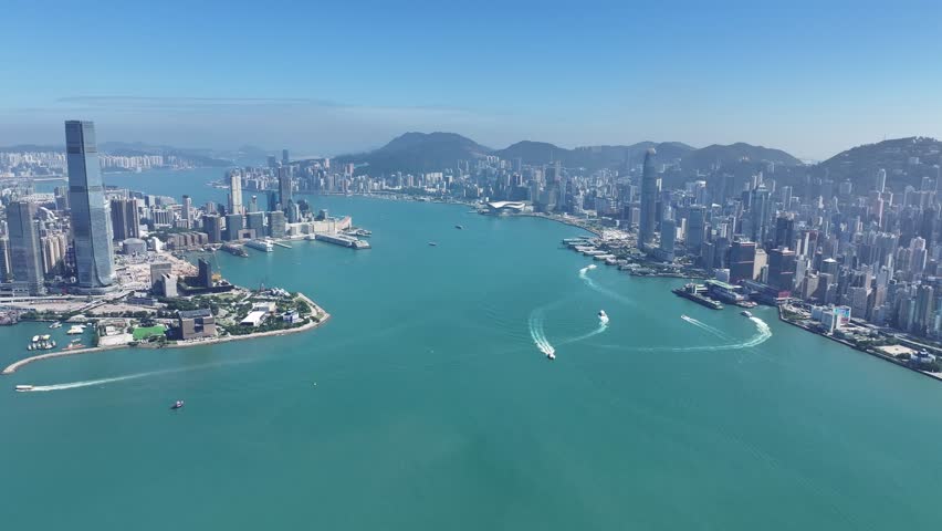 Drone aerial shot Skyview in Wan Chai Admiralty Tsim Sha Tsui Mong Kok Jordan Austin Yau Ma Tei Central West Kowloon Hong Kong , a commercial hub with the financial of the Victoria Harbour Royalty-Free Stock Footage #3408390943