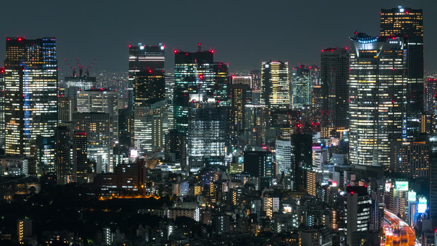 Timelapse of high rises at night in Tokyo in Japan Royalty-Free Stock Footage #3408408453