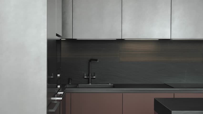 Kitchen interior in dark colors, kitchen sink and faucet,. Modern luxury kitchen interior in black and grey colors. Black ceramic tiles on the wall and countertop and wooden facade, slow motion shot.