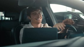 Carefree Caucasian driver man sit inside car turning on radio dancing enjoy sound music song dancing clap with hands on steering wheel drive rent auto road traffic modern computer device automobile - Powered by Shutterstock - Get 15% off with code: PIKWIZARD15