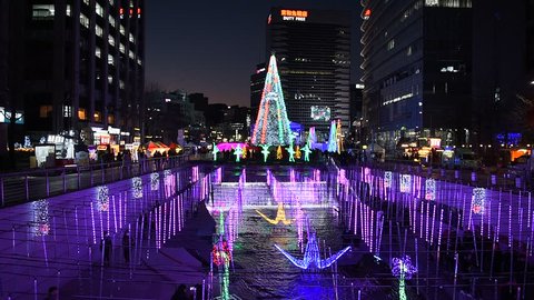 SEOUL, SOUTH KOREA - DECEMBER 16, 2017 : Cheonggyecheon Stream,People walking on Beautiful Christmas Light at night in Seoul, South Korea, 