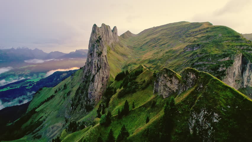 Aerial view landscape of majestic rocky mountain ridge of Saxer Lucke, Swiss Alps in autumn during the evening at Appenzell, Switzerland