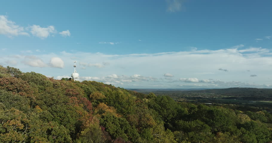 Flight Above Fall Forest On Mountain With Water Tank And Telecom Tower Atop. Mount Sequoyah In Fayetteville, Arkansas. aerial shot