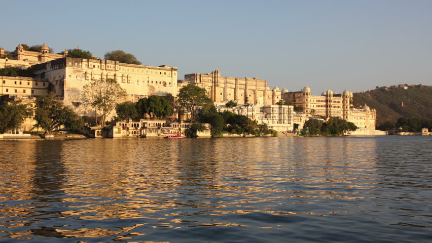 night follows day - palace on lake in Udaipur India
