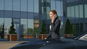 Luxurious businesswoman talking mobile phone getting into expensive car. Beautiful woman boss open door premium automobile calling smartphone. Elegant busy lady ceo going to business meeting by auto - Powered by Shutterstock - Get 15% off with code: PIKWIZARD15