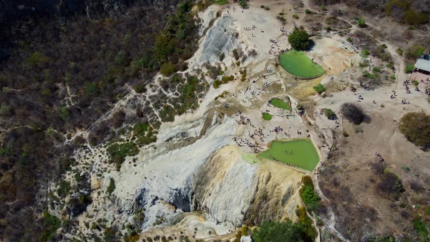 top of a white mountain with blue lakes and springs in Mexico hierve del agua oaxaca drone view