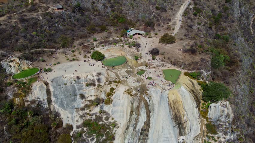 top of a white mountain with blue lakes and springs in Mexico hierve del agua oaxaca drone view