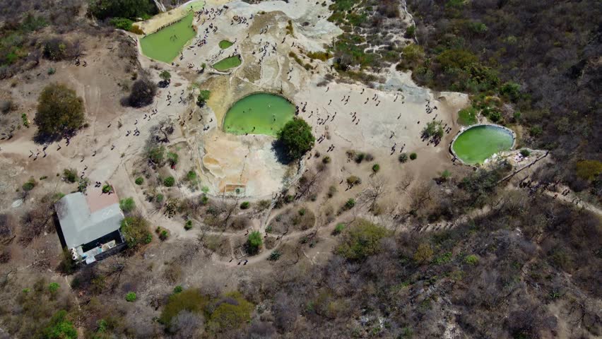 top of a white mountain with blue lakes and springs in Mexico hierve del agua oaxaca drone view