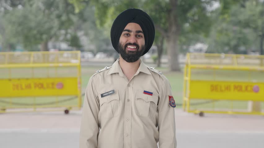 Happy Sikh Indian police man smiling