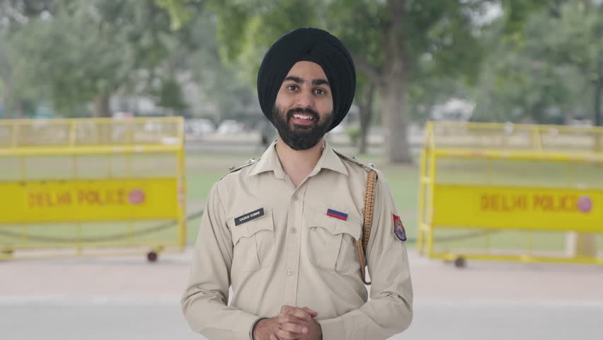 Happy Sikh Indian police man talking