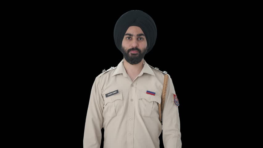 Happy Sikh Indian police man doing Namaste