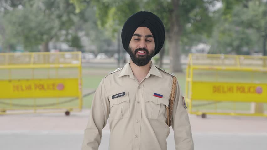 Happy Sikh Indian police man clapping and appreciating