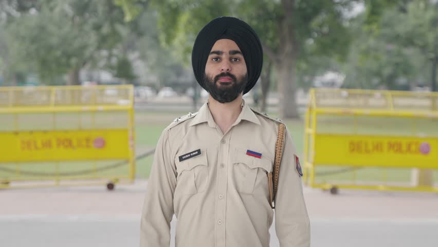 Proud Sikh Indian police man saluting