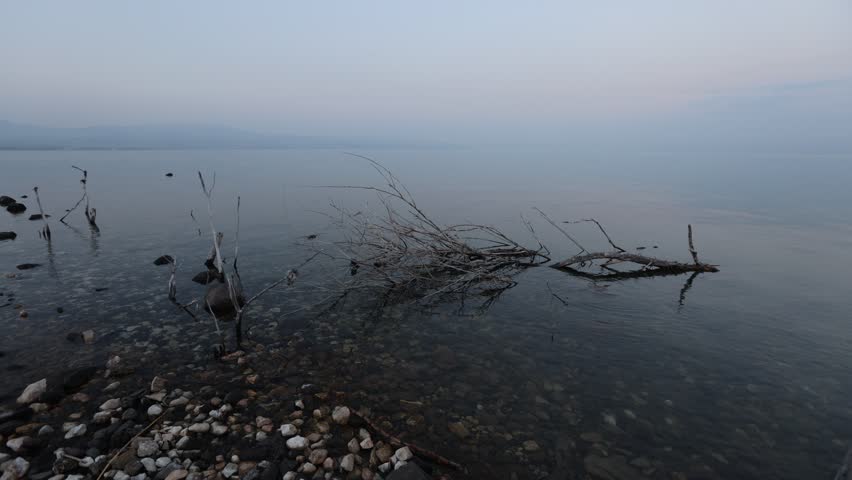 Video of beach and water of sea of Galilee in Israel. Sacred holy place for christians and jewish pepole. Blue relaxing water. 
