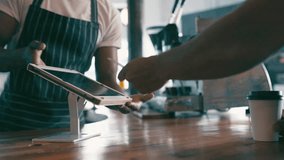 Barista, customer and credit card on tablet or coffee shop POS for digital payment and business services. Cashier or people hands at point of sale or cafe with digital screen, tap or scan for order - Powered by Shutterstock - Get 15% off with code: PIKWIZARD15
