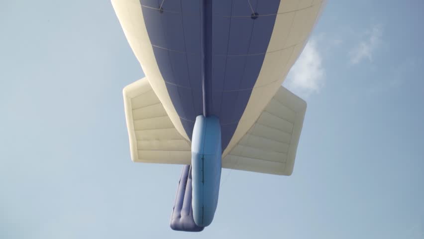 Airship Zeppelin flies overhead, close-up
