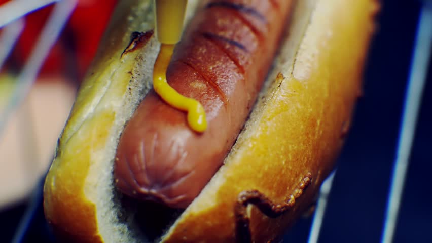 Hot Dog Served Mustard And Ketchup. American Fast Food. Tasty Hot Dog With Grilled Sausage. Appetizing Street Food. Grilled Sausage Hot dog Junk Food. Adding Ketchup And Mustard To Tasty Hot Dog Meat Royalty-Free Stock Footage #3409361435