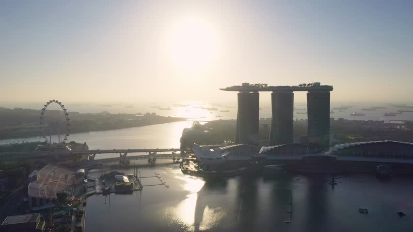 Aerial view, Traffic on the highway road with construction Of the city skyline at night in Singapore.