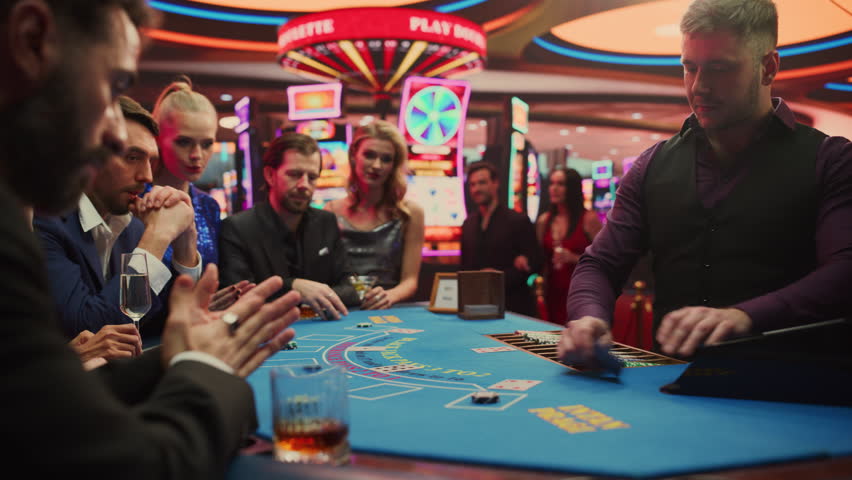 Portrait of People Cheering and Celebrating the Winner of a Blackjack Game in a Modern Casino. Group of Diverse Friends Having Fun on a Night Out Together, Living the Thrill of Gambling. Vibrant Edit Royalty-Free Stock Footage #3409496043