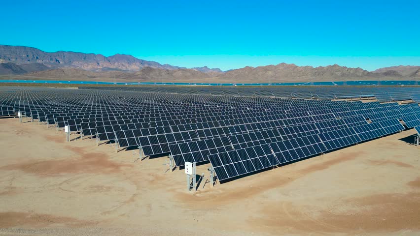 An aerial shot showing an vast solar farm outside of the major city of Las Vegas, Nevada Royalty-Free Stock Footage #3409498133