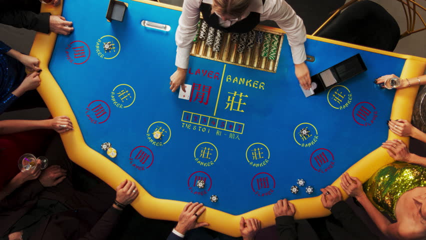 Top Down View Of Glamorous Casino Gamblers Placing Bets and Having Fun While Winning at Baccarat Table. Professional Croupier Dealing Cards, VIP People Enjoying Luxurious Lifestyle, Feeling Lucky.