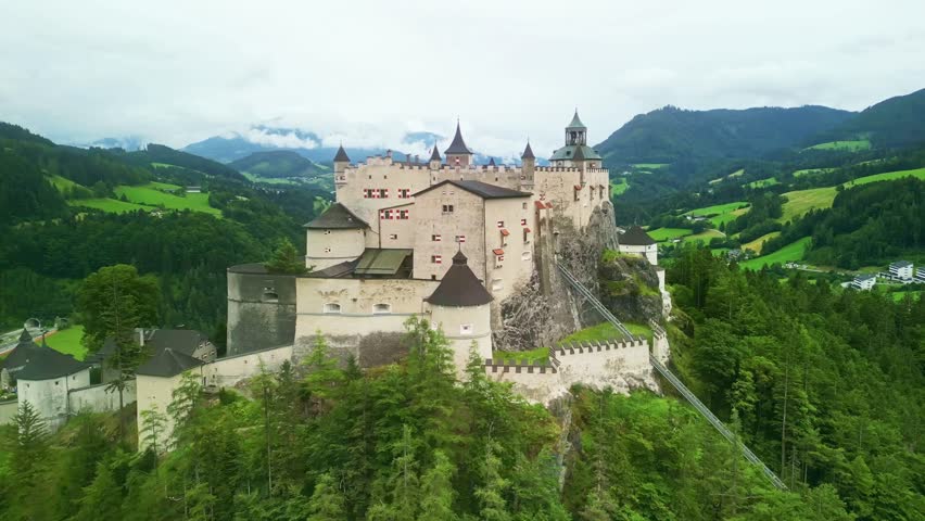 Aerial Drone view Austria. Hohenwerfen castle medieval fortress landmark in Austrian Alps. popular tourist sightseeing day trip from Salzburg. 