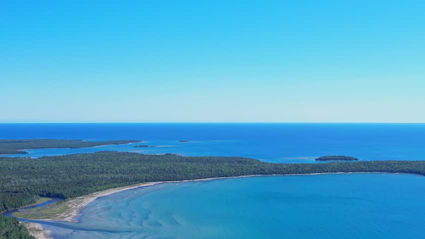 Majestic aerial view of Michael's Bay, Lake Huron, Manitoulin Island. Tranquil waters setting for outdoor enthusiasts. Boating and fishing, adventure and exploring the wilderness. Picturesque retreat Royalty-Free Stock Footage #3409521069