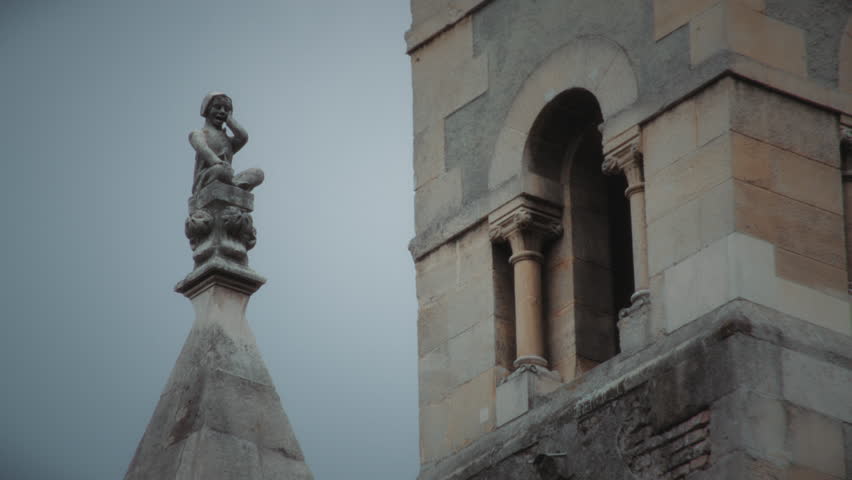 Close up of stone statue on one of the ancient churches in Budapest, Hungary. Slow motion.