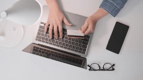 The girl in the personal account of the online store uses a credit card to pay for purchases, ensuring the simplicity and security of transactions. Top view of buying through laptop on the Internet - Powered by Shutterstock - Get 15% off with code: PIKWIZARD15