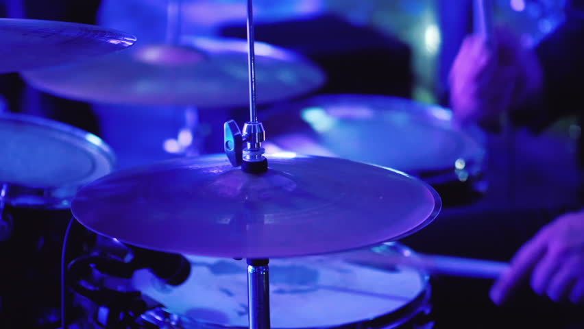 The drummer plays in a nightclub. Drum sticks hit the plates. Video with shallow depth of field | Shutterstock HD Video #34096960