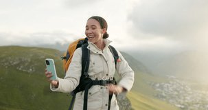 Woman, hiking on mountains and video call for travel update, social media and eco friendly tourism on blog. Young influencer waves hello in adventure live stream on hill, rock and nature for journey