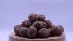 Walnuts rotating on a turntable. Turning walnuts.