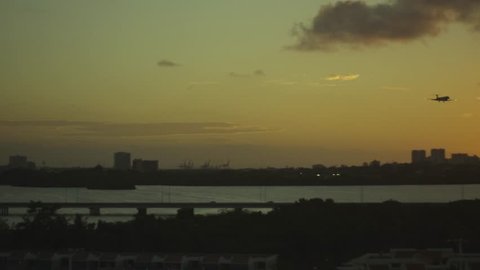 Beautiful shot of airplane landing in Puerto Rico during Sunset