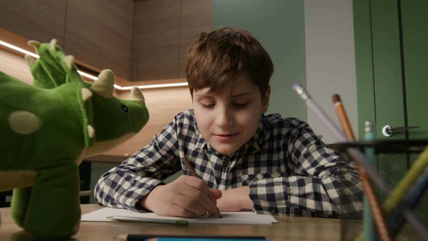 Autistic Kid Sketches Dinosaur Toy Masterpiece Royalty-Free Stock Footage #3410034895
