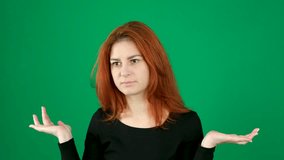 Young redhead woman with glasses and having doubts spread your arms to the sides - Powered by Shutterstock - Get 15% off with code: PIKWIZARD15