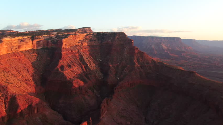 Aerial cinematic drone Moab Utah dramatic orange sunset mountain snow covered peak Big Enchilada landscape Arches National Park Castle Valley Castleton Fishers Tower Green River camping right slowly