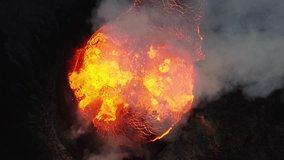 Close look on volcano in super slow motion. Volcanic eruption of the Fagradalsfjall (Geldingadalur) in Reykjanes peninsula Iceland. View from top, static shot. - Powered by Shutterstock - Get 15% off with code: PIKWIZARD15